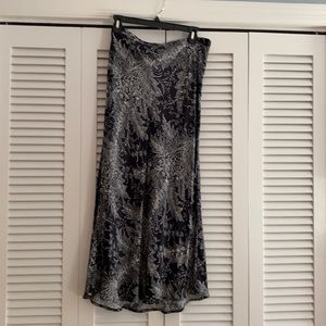 Deep navy blue skirt with white floral pattern.